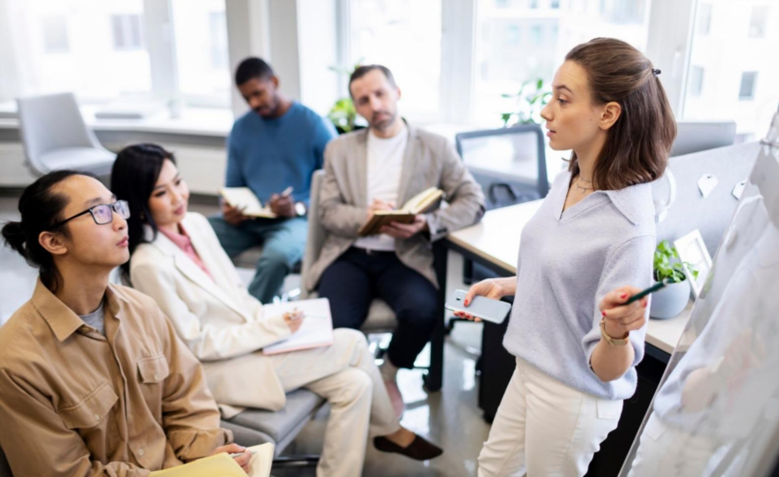 Financial analysts working collaboratively on advanced modeling techniques in a modern learning environment